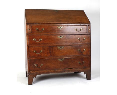 An 18th century oak bureau, the fall front over four graduated drawers on bracket feet, w. 96 cm CONDITION REPORT: Structural