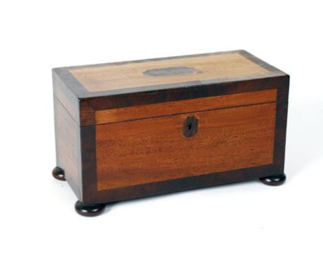 A 19th century mahogany and crossbanded tea caddy of rectangular form on bun feet, w. 32 cm CONDITION REPORT: No mixing bowl