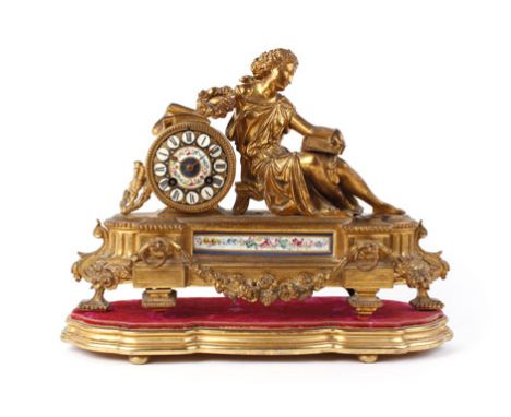 A French 19th century mantel clock, striking on a bell, the enamelled and painted face with Roman numerals, within a gilt met