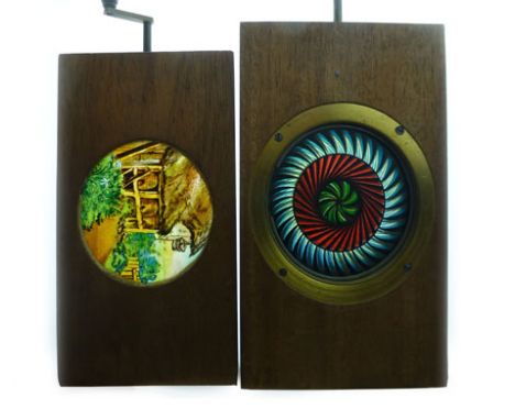 Two functioning Mahogany-framed Mechanical Coloured Lantern slides featuring bees around beehives and a rotating circular pat