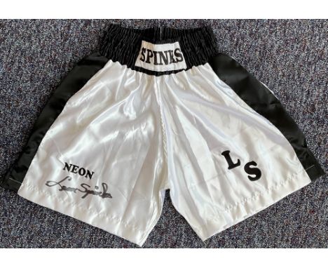 Boxing Legend, Leon Spinks Signed Personalised Boxing Shorts. These white shorts are signed in black marker pen and have the 