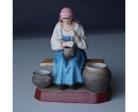 This finely crafted porcelain figurine by the Gardner Factory of Russia depicts a peasant woman seated on a wooden bench as s