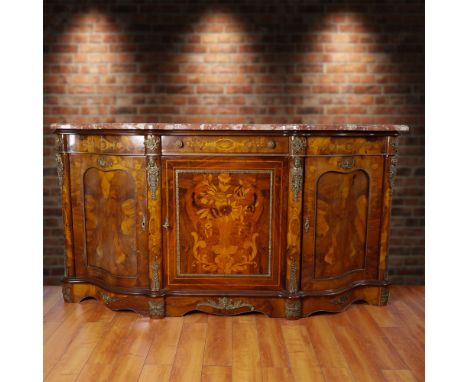 This Louis XV style, featuring an elegant serpentine silhouette, faux marquetry, and gilt faux-bronze ormolu mounts. The piec