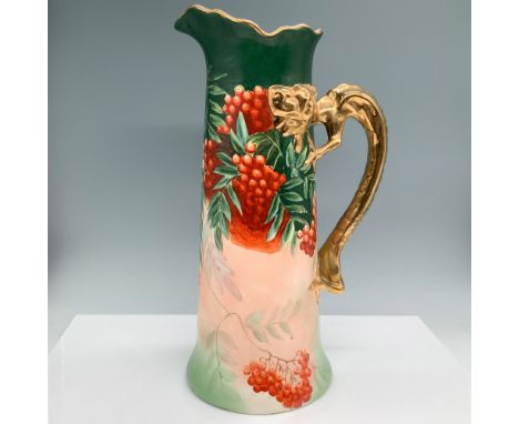 Jean Pouyat Limoges hand-painted porcelain pitcher featuring an ornate gilded dragon handle and a vibrant design of red berri