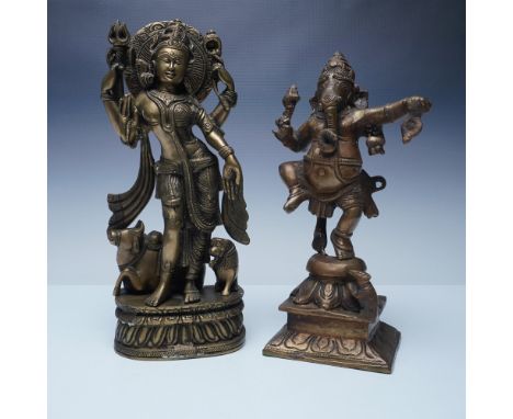 A pair of finely crafted brass sculptures featuring Hindu deities. The first sculpture depicts Durga (12"H), the revered warr