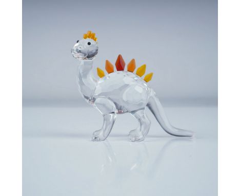 This Swarovski Crystal Dino Dinosaur figurine was part of the Fairy Tales Collection. It features a clear crystal body with a