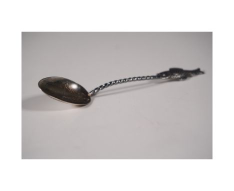 A unique vintage sterling silver souvenir spoon featuring an embossed scene of a sailing vessel with the inscription "Atlanti