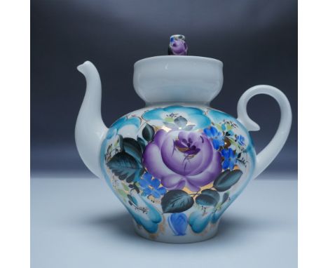 This elegant hand-painted porcelain teapot is marked Made in USSR, identifying it as a product of the renowned Lomonosov Porc