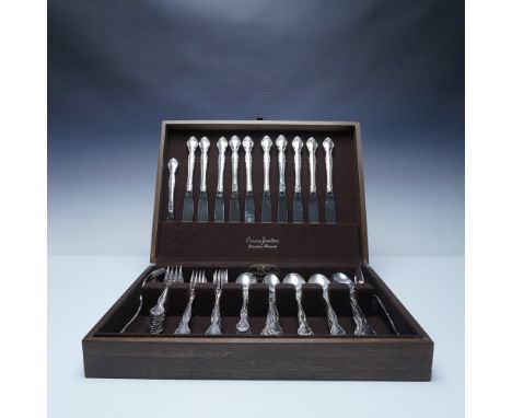 A 59-piece Community flatware set featuring an elegant floral and scroll pattern. The set includes 1 butter knife, 10 dinner 