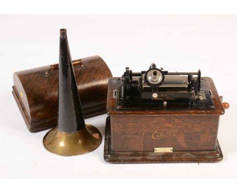 An Edison Standard Phonograph, serial number 592923, with oak case and cover, black lacquered and brass horn, approximately 3