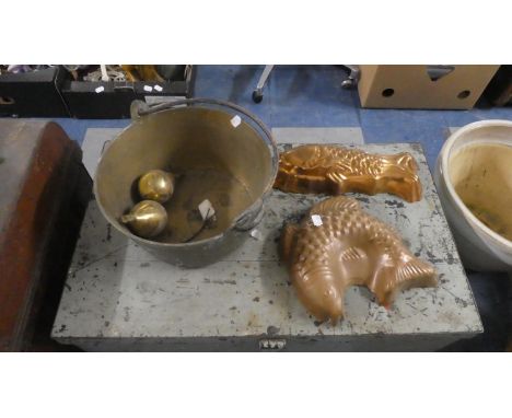A Brass Jam Kettle, Two Clock Weights and Two Copper Jelly Moulds 