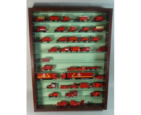 A Large 9 Shelf Display Case Containing 37 Diecast Royal Mail Trucks, Lorries and Horse Drawn Vehicles, Various Makes 