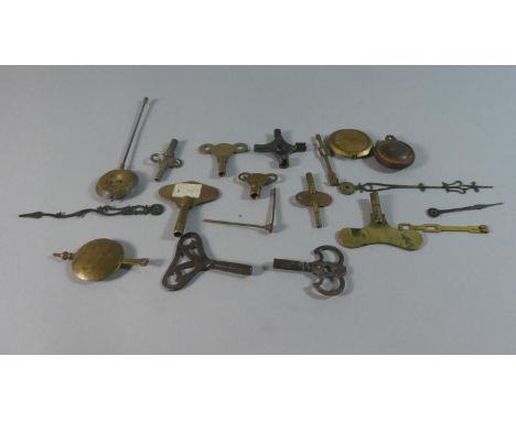 A Collection of Vintage Clock Keys and Pendulums 