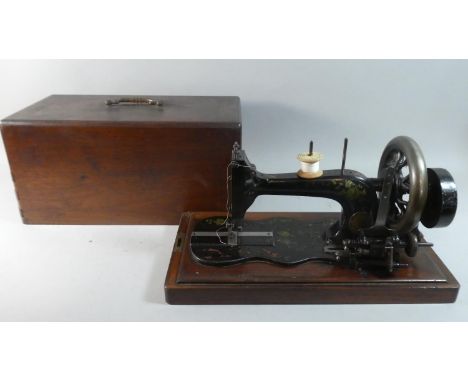 A Vintage Mahogany Cased Frister and Rossmann Sewing Machine 
