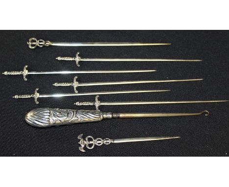 Victorian silver handled button hook, London 1887, maker GH, five white metal skewers in the form of swords, two white metal 