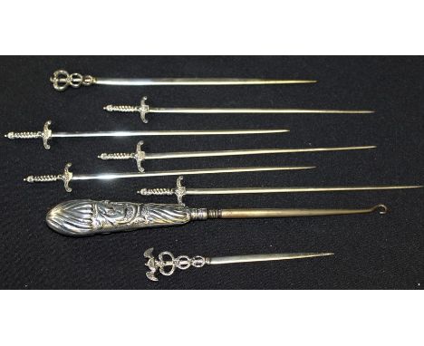 Victorian silver handled button hook, London 1887, maker GH, five white metal skewers in the form of swords, two white metal 