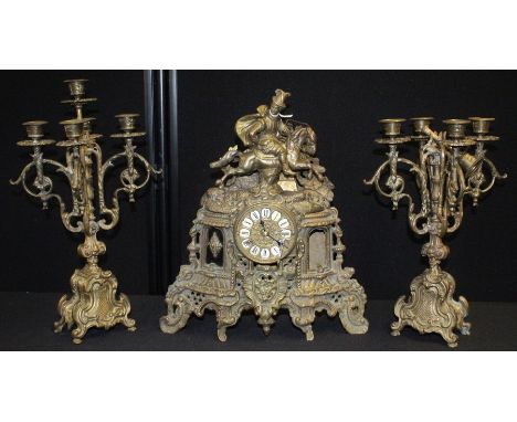 Franz Hermle brass mantel clock garniture, the clock with figure on horseback to the pediment, the dial with Roman numerals, 