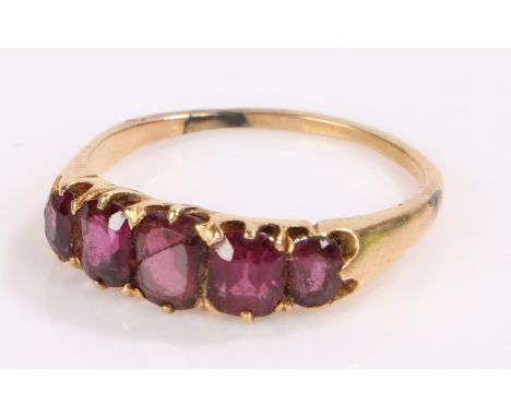 Yellow metal amethyst set ring, with five amethysts to the head