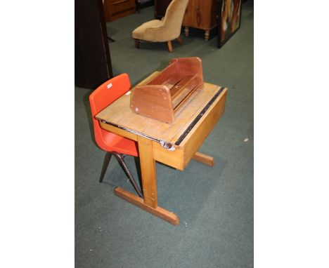 Light wood school desk with hinged lid, 56cm wide, together with a child's chair with red plastic seat and a book trough (3)