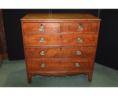 19th Century oak chest of two short and three long drawers, above a shaped apron, raised on bracket feet, 108cm wide