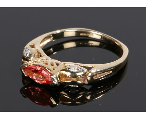 9 carat gold padparadscha sapphire, the marquise cut padparadscha at 0.52 carat flanked by diamonds to the shoulders, ring si