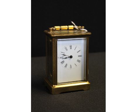 Brass cased carriage clock, the white dial with Roman numerals