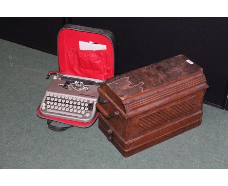 Singer manual sewing machine, housed in a travelling case, Empire Corona typewriter housed in a black leatherette travelling 