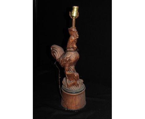 Cockerill lamp, with a raised claw on a rock, 56cm high