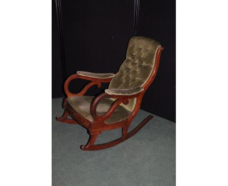 Victorian mahogany rocking chair, with green velvet button upholstered back, seat and arms