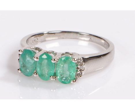 Zambian emerald and white topaz ring, set to a silver shank, ring size N 1/2