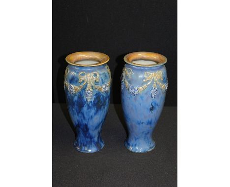 Pair of Royal Doulton vases, the blue marble effect ground with tied bow, harebell and fruiting vine swag decoration, 26.5cm 