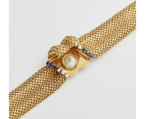Jaeger LeCoultre Cocktailuhr18 kt Gelbgold. Aufklappbare Damenarmbanduhr mit Kunststoffglas. Gehäusedeckel gerahmt von jeweil