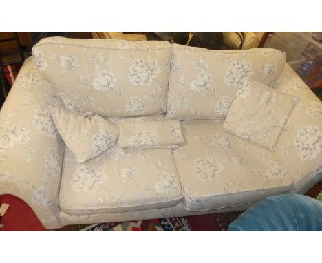 A contemporary DFS cream floral upholstered three-seater sofa, width 190cm