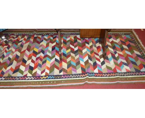 A contemporary Kurdish Kelim mutli-coloured rug, 277 x 126cmCondition report: Overall good condition. Some dirt marks and gen