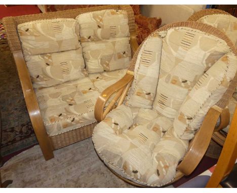 A contemporary wicker three-piece conservatory suite comprising; two-seater sofa, and a pair of tub swivel armchairs, each wi