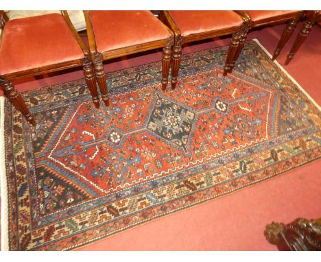 A Persian woollen red ground Malayer rug, 200 x 109cmCondition report: Overall condition is very good. Some light wear in pla
