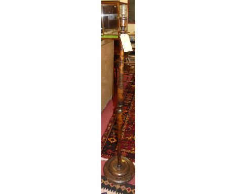 A turned stained wood standard lamp 