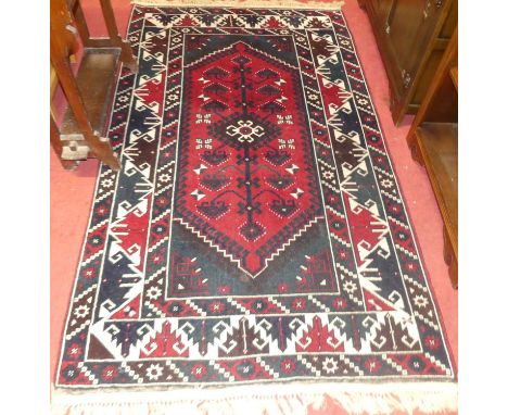 A Persian woollen red ground Shiraz rug, 210 x 122cmCondition report: Very good condition.  Colours are good and strong.  Som