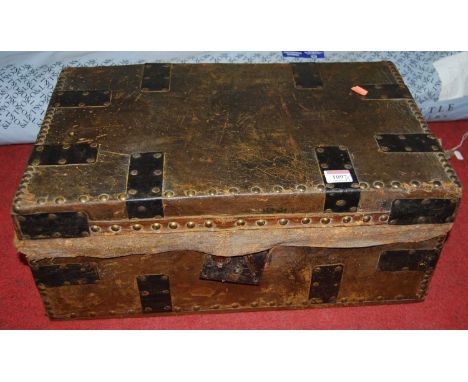 A studded leather and metal bound small trunk, w.53cm