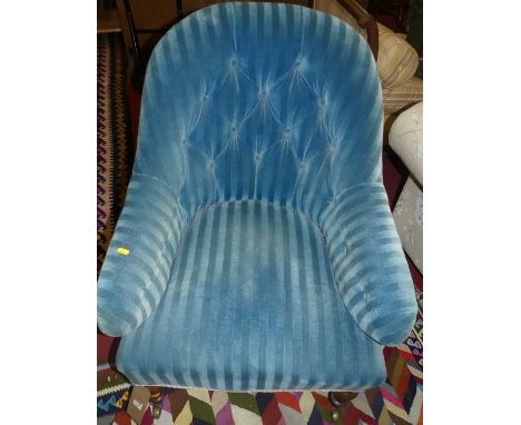 A mid-Victorian mahogany framed and blue striped button upholstered tub armchair, on turned forelegs, width 70cm