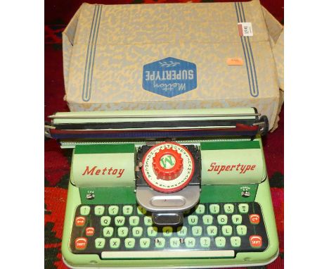 An original boxed Mettoy tinplate Supertype typewriter