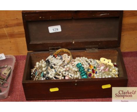 A wooden trinket box and contents of various costume jewellery