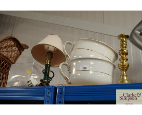 A pair of brass candlesticks; a pair of chamber pots; table lamp and a glass vase 