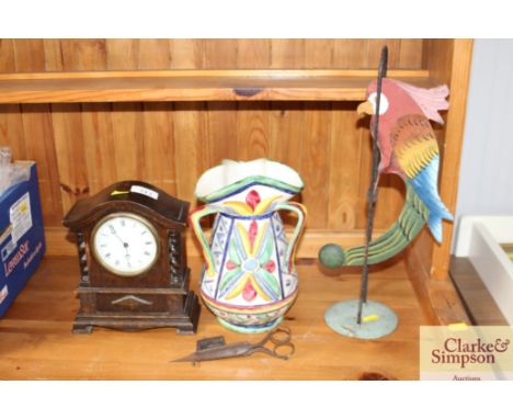An oak cased mantel clock and a swinging parrot ornament etc.