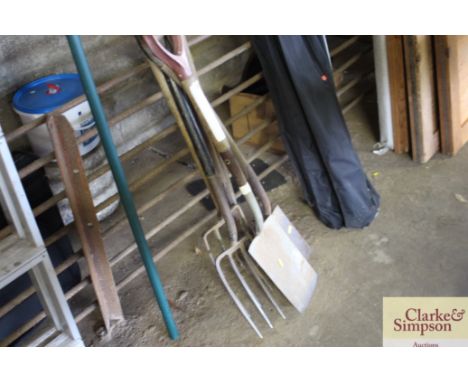 A quantity of long handled gardening tools