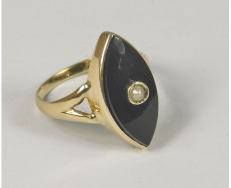 ONYX RING. A 14k. black onyx marquise shaped ring set a central natural seed pearl. Size G.