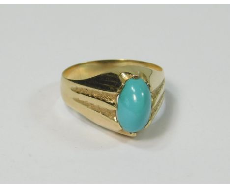 TURQUOISE RING. A hand made 18ct. gold cabouchon turquoise ring. Size P.