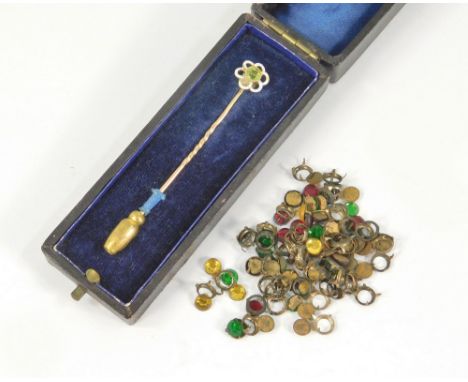 STICK PIN ETC. A Victorian stick pin set a peridot within a white & black enamelled flower head border, cased. Also, a small 