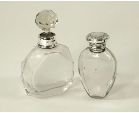 SCENT BOTTLES. A silver mounted cut glass scent bottle with stopper & a silver mounted blown scent flask, with glass stopper.