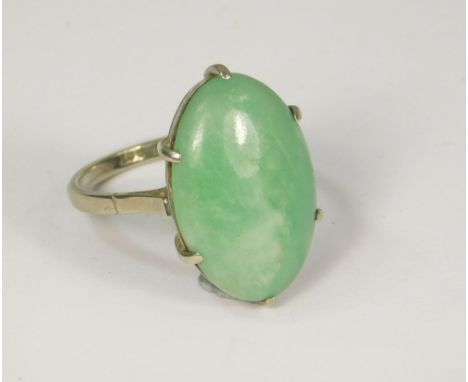 JADE RING. A jade dress ring set in 9ct. white gold. Size P.